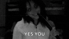 a black and white photo of a woman holding a knife and saying yes .