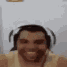 a man wearing headphones is taking a selfie .