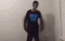 a blurry picture of a person standing in a room with a window .
