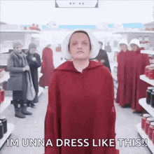 a woman in a red dress is standing in a grocery store .