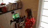 a girl is singing into a microphone in front of a screen that says ' off '