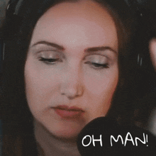 a close up of a woman 's face with the words oh man below it