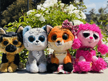 a group of stuffed animals including a fox and a poodle