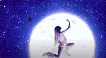 a woman is kneeling in front of a full moon with a bird flying in the background