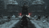 a video game is being played in a snowy area with a giant statue in the background