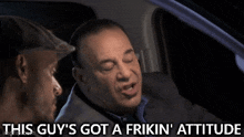 a man in a car says " this guy 's got a frikin attitude "
