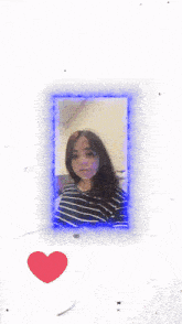 a girl in a striped shirt is taking a picture of herself in a mirror