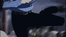 a man in a blue shirt and black pants is standing in the dark holding a gun .