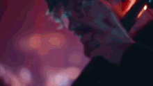 a close up of a person 's face with a blurred background