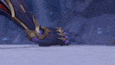 a close up of a person 's foot in a video game with a purple and gold armor .
