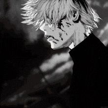 a black and white drawing of a man 's face with a few spots of blood on his face