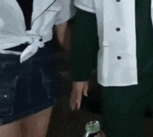 a man and a woman are holding hands in a room .