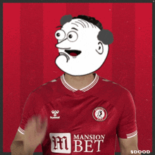 a man wearing a red hummel jersey is clapping