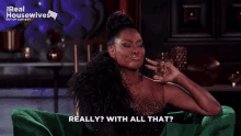 a woman sitting in a green chair with the words really with all that behind her