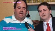 a man holding a microphone with the name giuseppe simone on the bottom