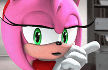 a close up of amy rose from sonic the hedgehog pointing at something
