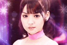 a woman wearing a pink choker is looking at the camera