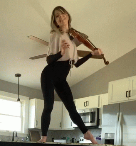 Lindsey Stirling Bow Swing GIF - Lindsey Stirling Bow Swing Tongue Out GIFs
