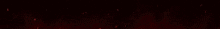 a close up of a red light beam on a black background