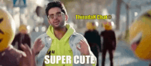 a man wearing sunglasses and a neon yellow hoodie says " super cute " in front of a crowd of people
