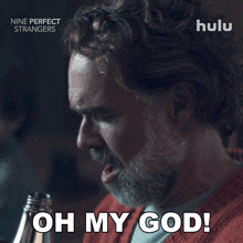 an advertisement for nine perfect strangers shows a man holding a bottle and saying oh my god
