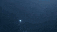 a statue of a man 's head is floating in the ocean .