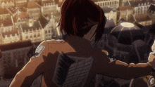 a woman with wings on her back stands in front of a cityscape