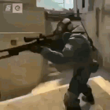 a soldier in a gas mask is holding a sniper rifle in a video game .