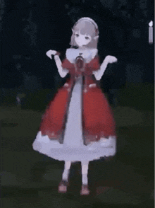a girl in a red dress is standing in a dark room .