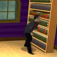 a man is standing in front of a bookshelf full of books in a room .