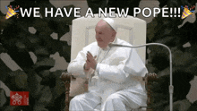 the pope is sitting in a chair with the words we have a new pope written above him