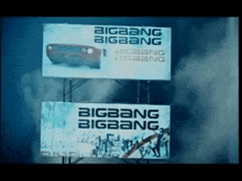 a billboard for bigbang bigbang with a picture of a car on it