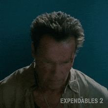 who is that trench arnold schwarzenegger the expendables 2 looking
