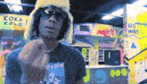 a man wearing sunglasses and a t-shirt that says of a down