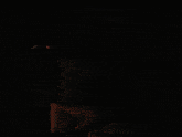 a pixelated image of a man holding a child