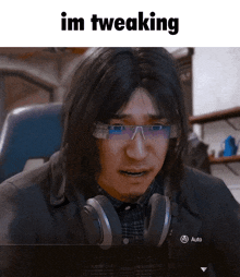 a man wearing headphones and glasses with the words im tweaking on the bottom