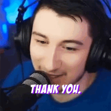a man wearing headphones is giving a thank you