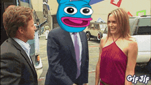a man in a suit and tie is shaking hands with a woman in a red dress with a gif jif logo on the bottom