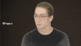 a blurry picture of a man with glasses and a viggle.ai logo