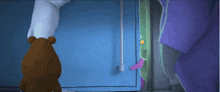 a teddy bear is standing in front of a blue cabinet
