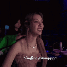 a woman in a pink dress is smiling with the words lingling kwongggg below her