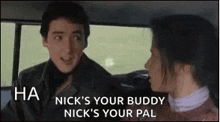 a man and a woman are sitting in a car and the man is talking to the woman .