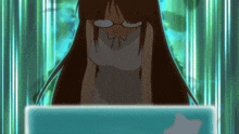 a girl wearing glasses is looking at a blue screen