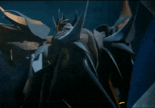 a close up of a robot with horns and a yellow light