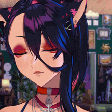 a close up of a girl 's face with her eyes closed and a necklace with a x on it