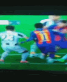 a blurry picture of a soccer game with the number 11 on the back
