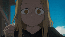 a girl with blonde hair is holding a metal object