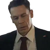 a man in a suit and tie with an american flag pin