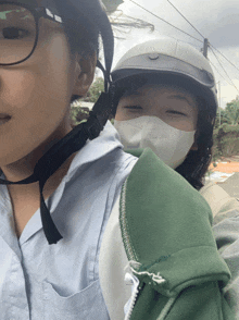 a woman wearing a helmet and a mask that says " pink girl " on it