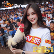 a woman holding a rooster wearing a shirt with sv388 on it
